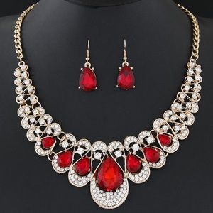 Red gemstone metal collar necklace earrings set with diamonds
